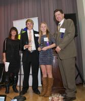 Oak-Leyden Developmental Services' Benefit honored Riley Edmunds and Madeline Strand of River Forest (center) for their efforts as co-chairs of the annual 9/11 Bonnie Brae Charity LemonAide Stand. They are accompanied by Bob Atkinson and Cara Carriveau